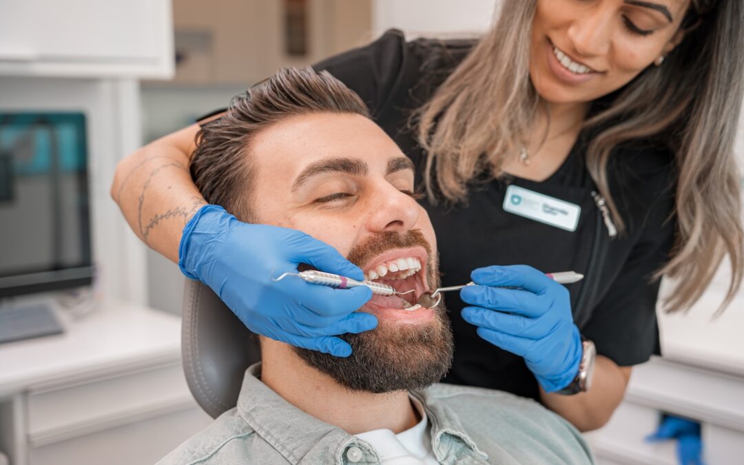 a person brushing a person's teeth